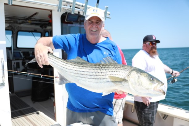 a person holding a fish