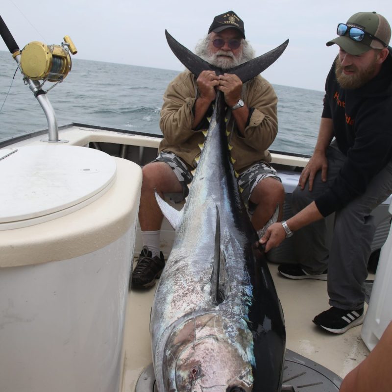 a person holding a fish
