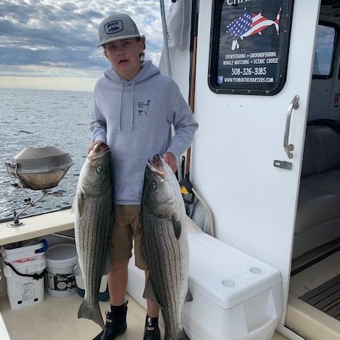 a man holding a fish