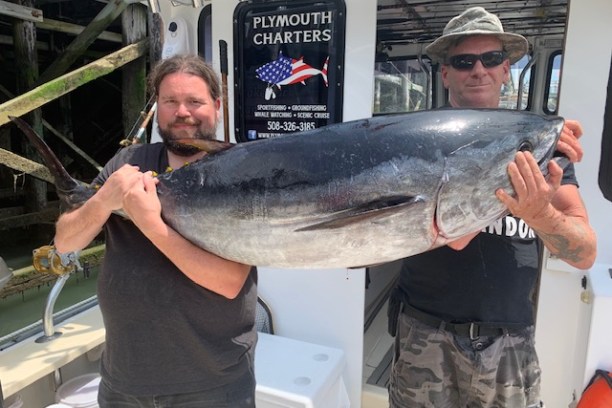 a man holding a fish